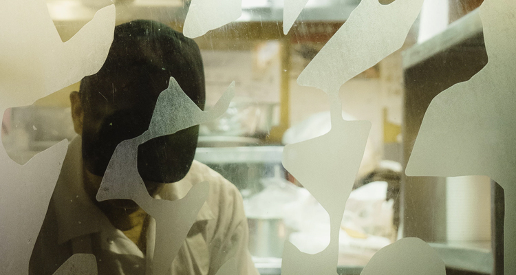 men working in a kitchen